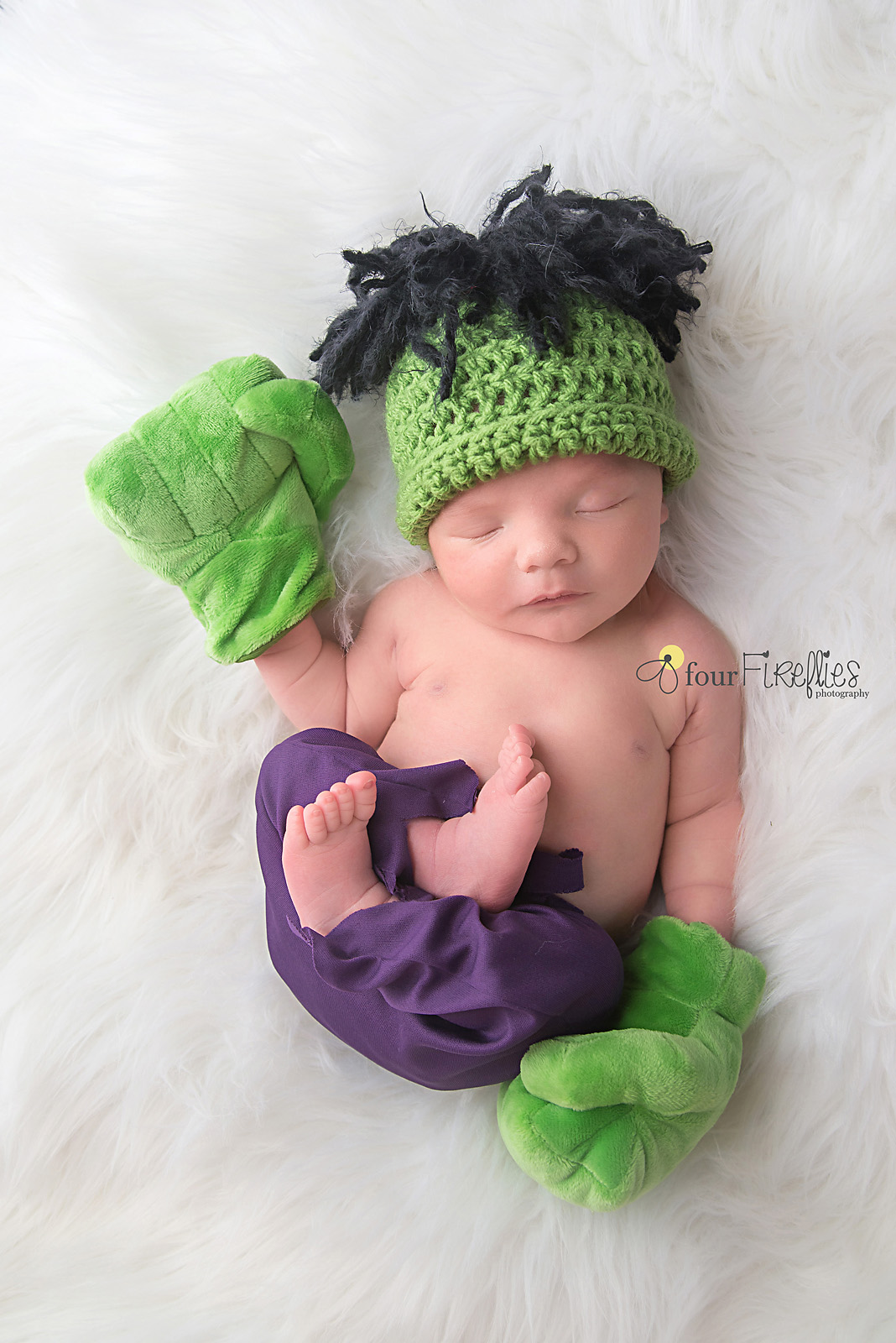 st-louis-newborn-photographer-baby-boy-in-hulk-costume-with-hands-and-purple-pants.jpg