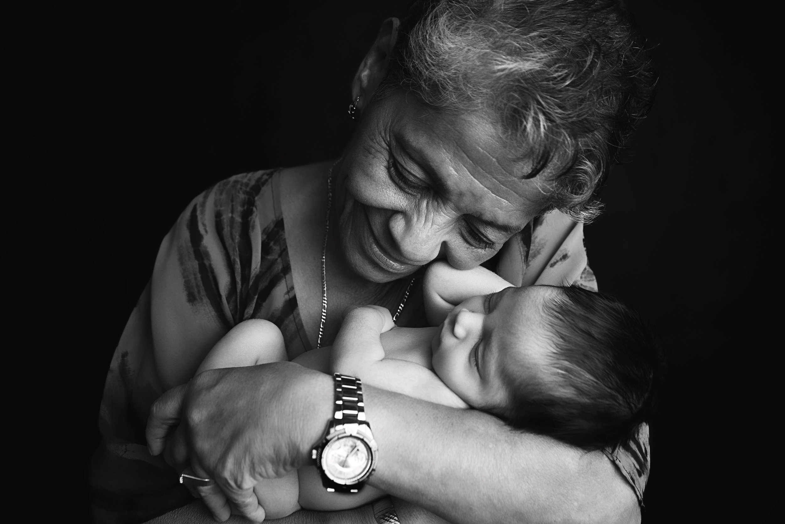 st-louis-newborn-photographer-black-and-white-of-grandma-cuddling-with-newbonr-boy.jpg
