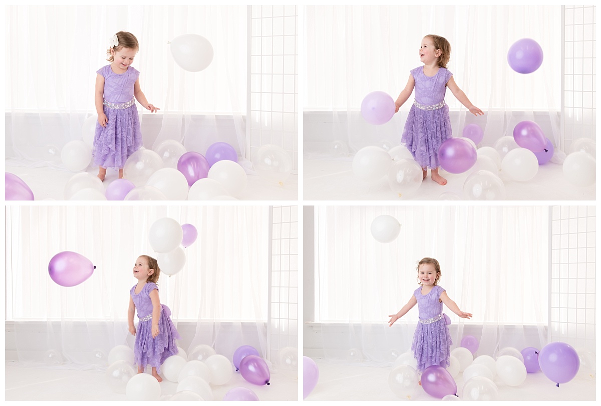 st-louis-birthday-photographer-three-year-old-girl-playing-with-balloons-in-white-room.jpg