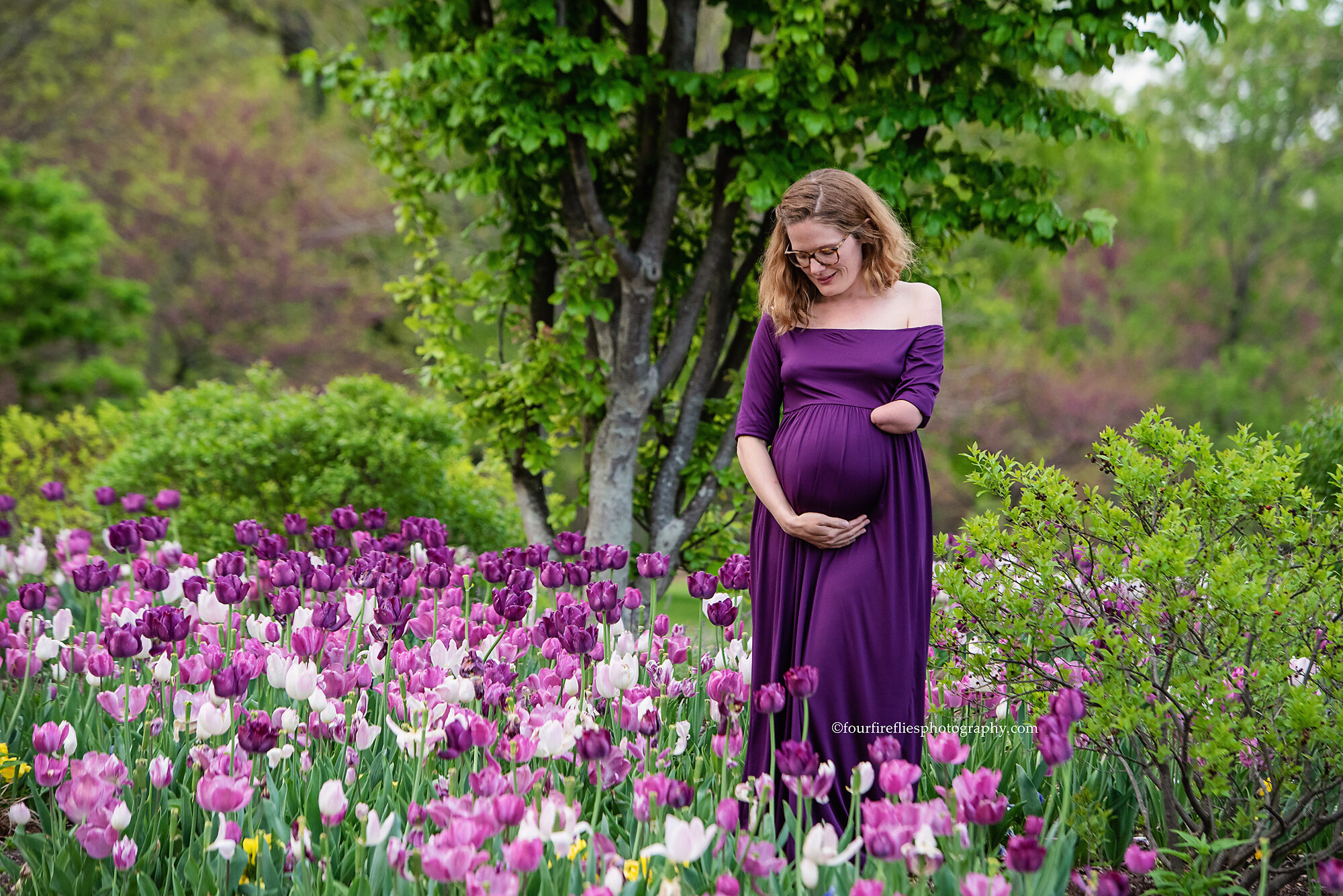 st-louis-maternity-photographer-expecting-mom-in-purple-gown-standing-in-purple-tulips-at-forest-park.jpg