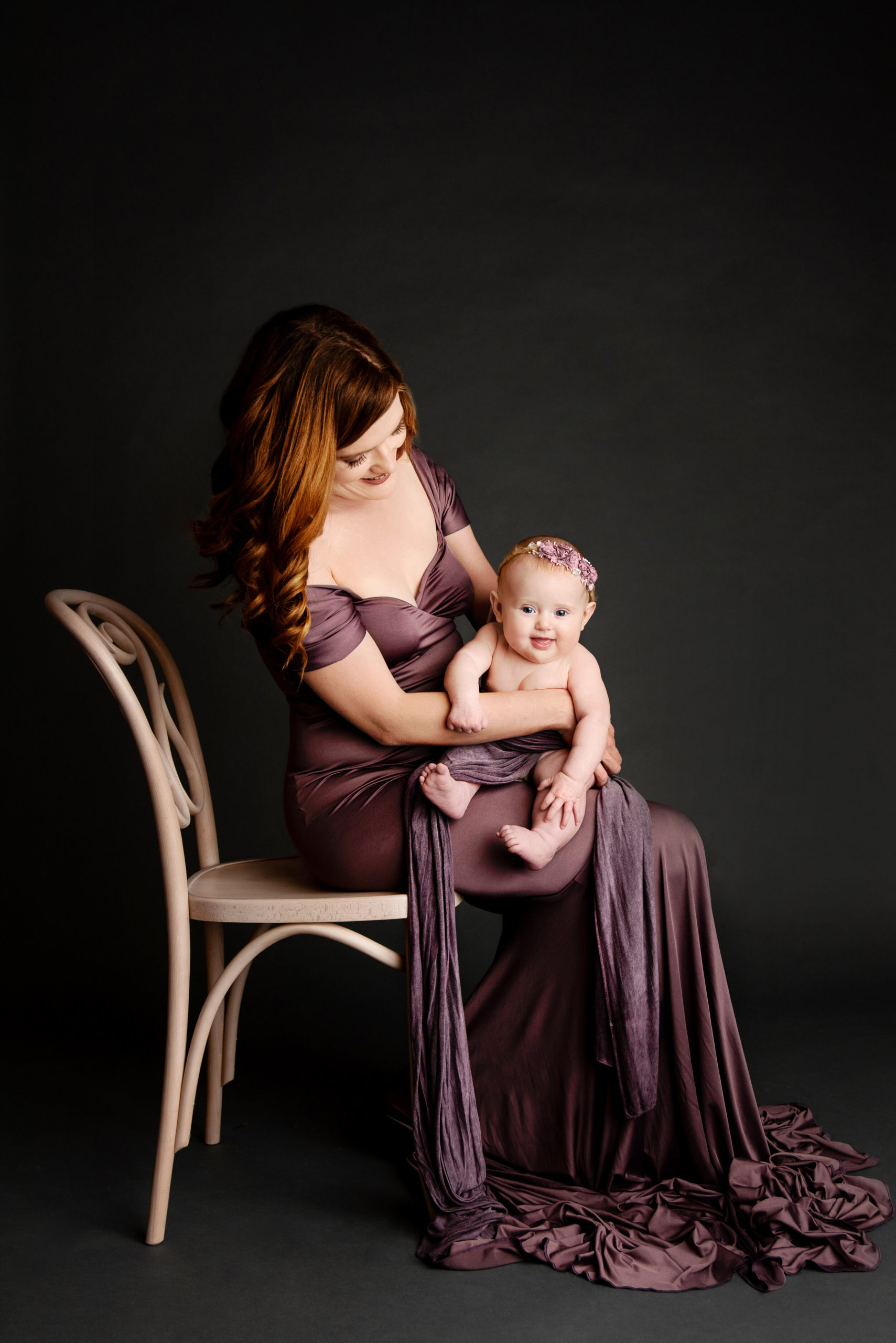 st-louis-motherhood-photographer-fine-art-photo-of-mom-in-purple-gown-holding-smiling-baby-girl.jpg