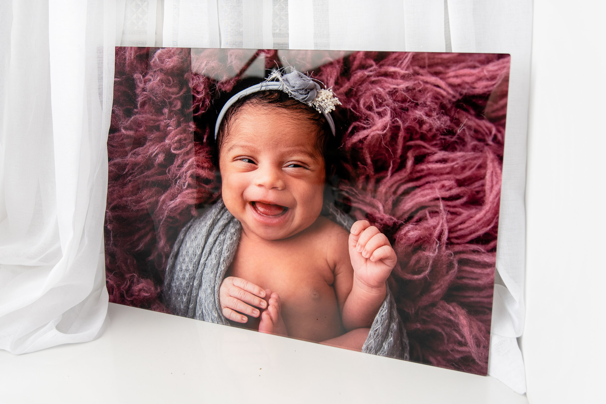 st-louis-newborn-photographer-acrylic-wall-art-print-of-smiling-baby-girl.jpg