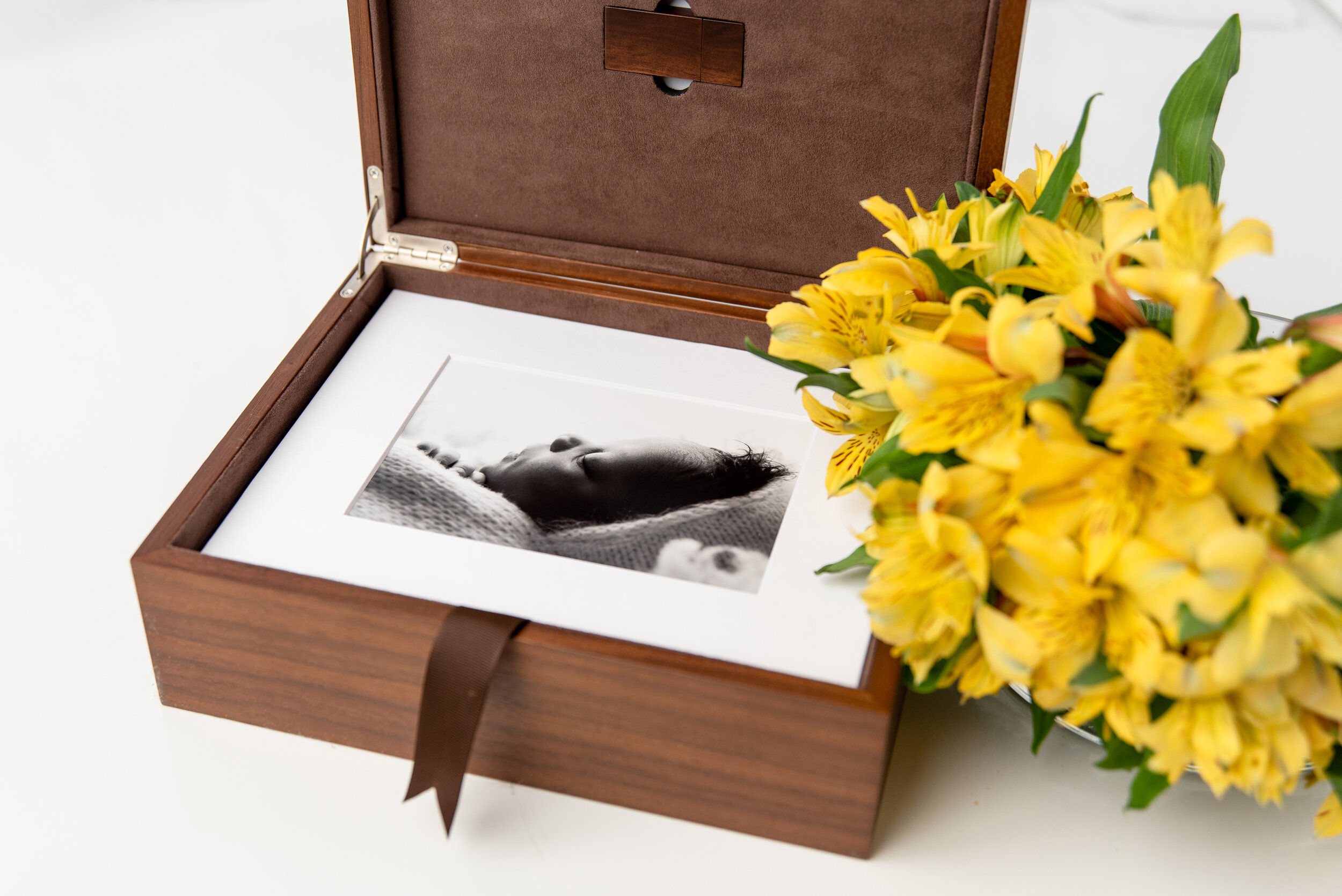 st-louis-maternity-newborn-photographer-open-wood-folio-box-with-baby-boy-and-yellow-floral-accent.jpg