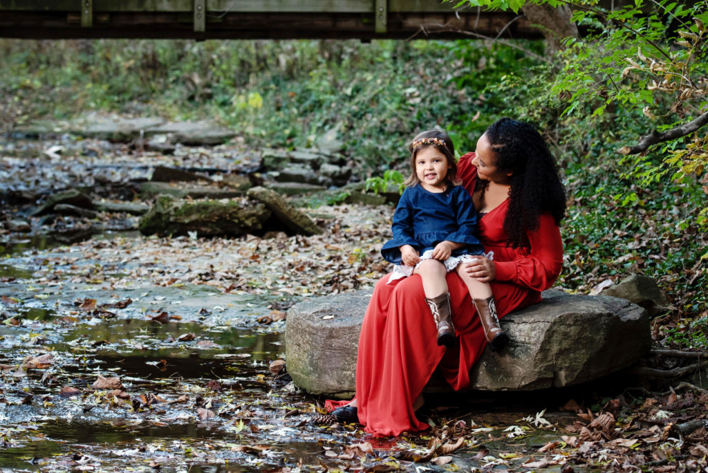 St-Louis-Fall-Mini-Sessions-mom-and-daugher-sitting-in-creek-bed-in-the-fall