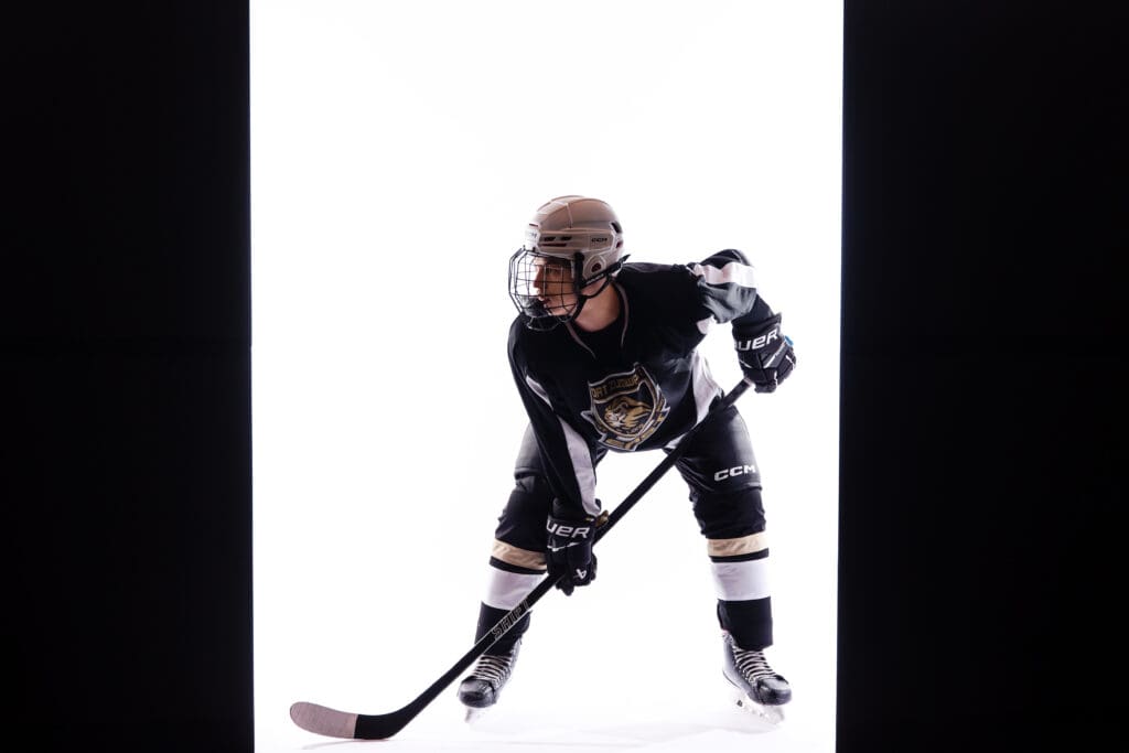 St. Louis Senior Photographer. teen boy in hockey uniform